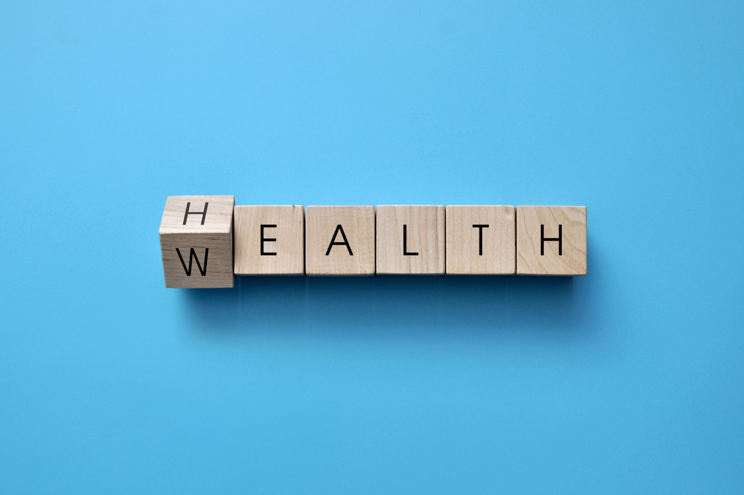 Wooden cubes with the words: health and wealth. Health is the ma