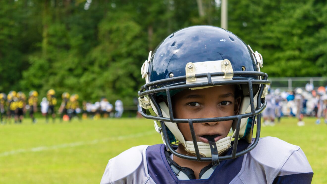 american football player with helmet on his head