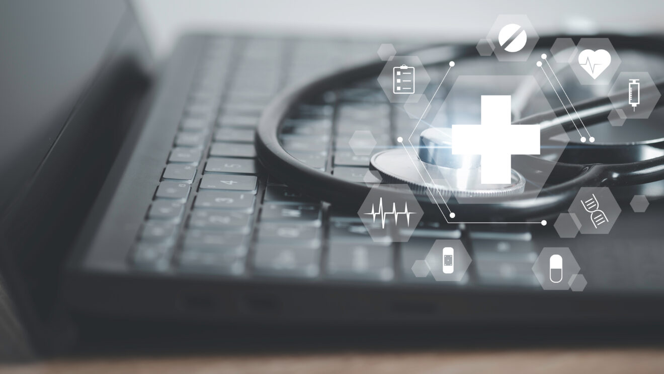 Close up of stethoscope and laptop keyboard. Digital healthcare