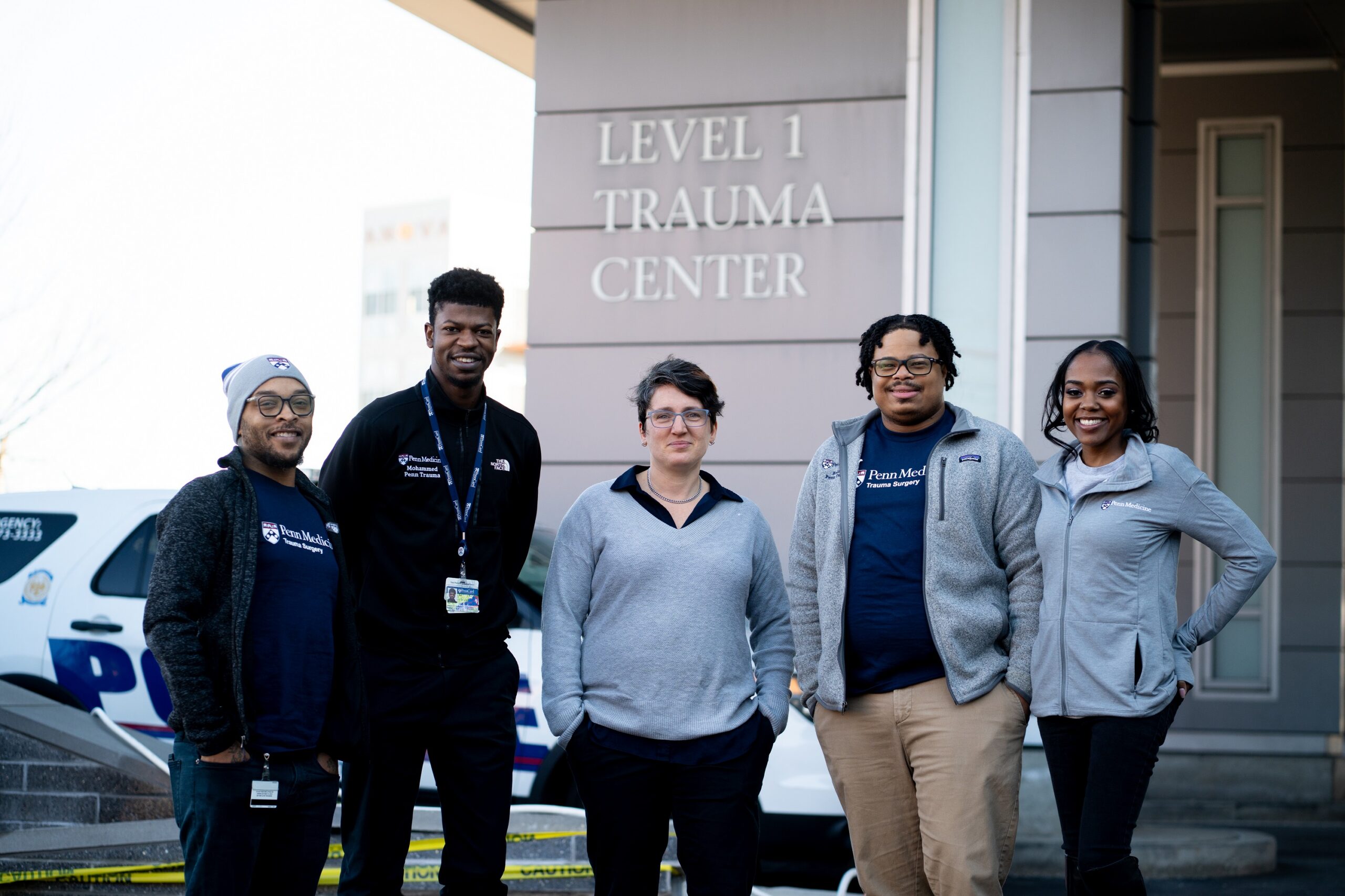 the PTVRP team poses for a photo in front of the trauma center